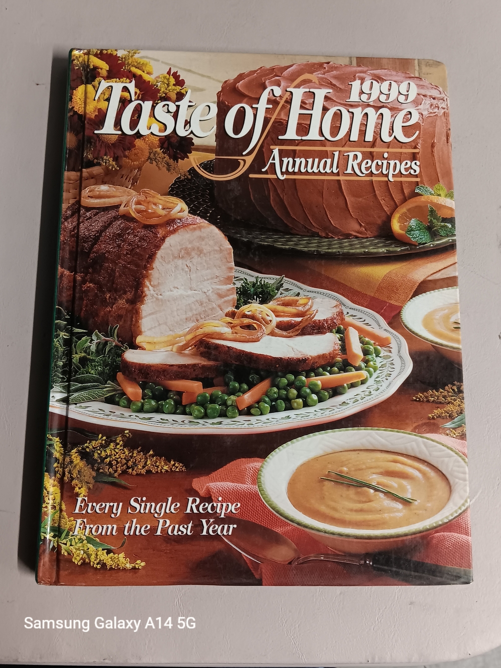 Taste of Home Cookbook with Orange Cover and Green Spine
